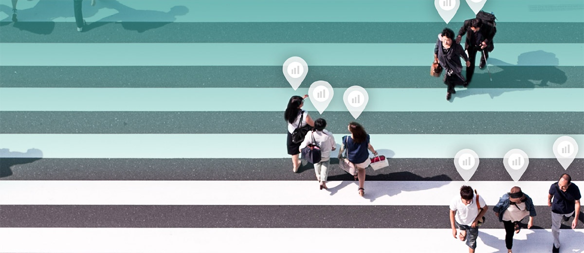 men and women of multiple ethnicities walking across a stylized crosswalk with superimposed statistic bubbles over their heads How to Boost and Measure ROI of SEO